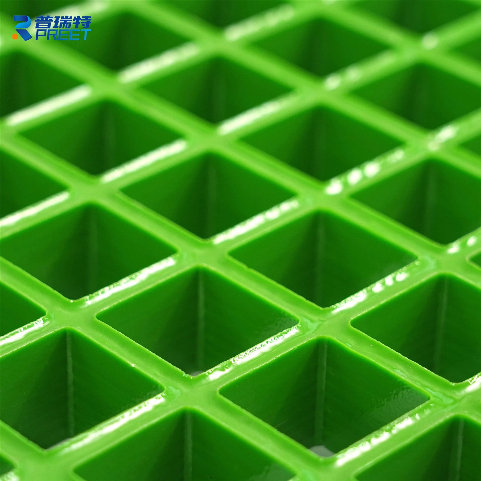 Close-up view of fiberglass reinforced plastic FRP grating panel used in industrial floor Close-up view of fiberglass reinforced plastic FRP grating panel used in industrial floor